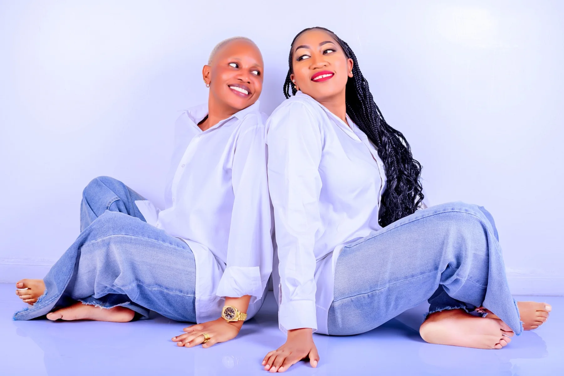 Two women photographed in a studio